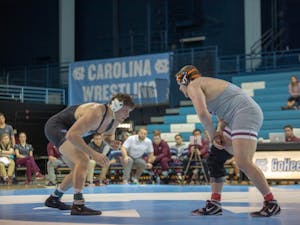 UNC senior Corey Daniel prepares to attempt a takedown during his bout against his Virginia Tech opponent  in Carnmichael Arena on Friday, Feb. 8, 2019. Daniel won his bout 3-2. Daniel's victory provided the points needed for UNC to further secure their lead and win the overall competition against Virginia Tech with a final score of 18-14.