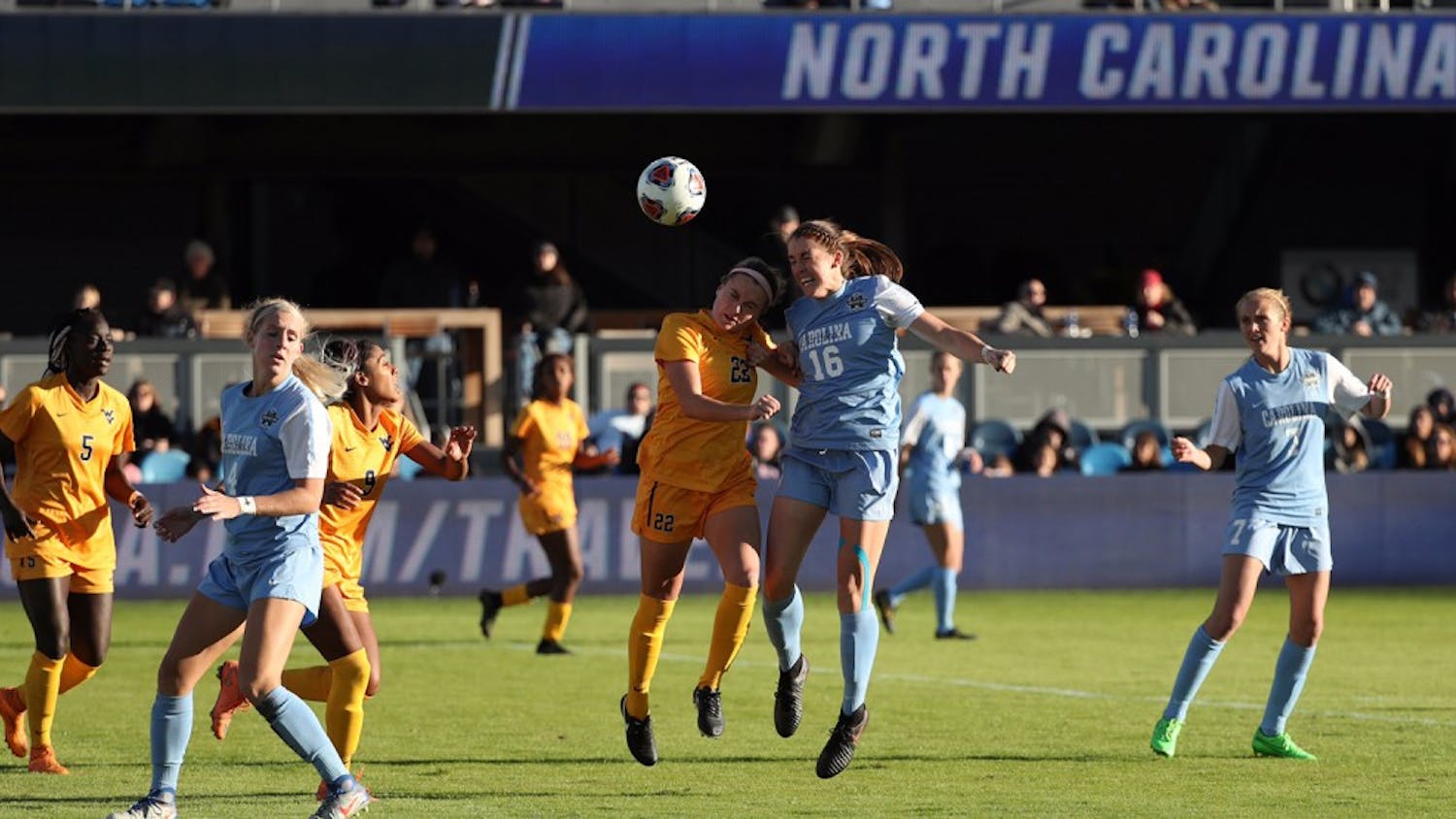 Sophomore defender Julia Ashley (16)&nbsp;goes up for a header against&nbsp;West Virginia on Friday. The Tar Heels fell 1-0 in the NCAA semifinal.&nbsp;