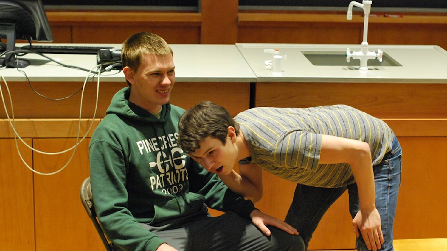 Senior Joey Rasmus (left) and Junior Eric Clayton (right) rehearse an improv skit. False Profits will be performing comedic stand-up, sketches, and improv at 8:00 tonight in Chapman 201. "We are excited to make the world a funnier place," says Junior Eric Clayton. 
