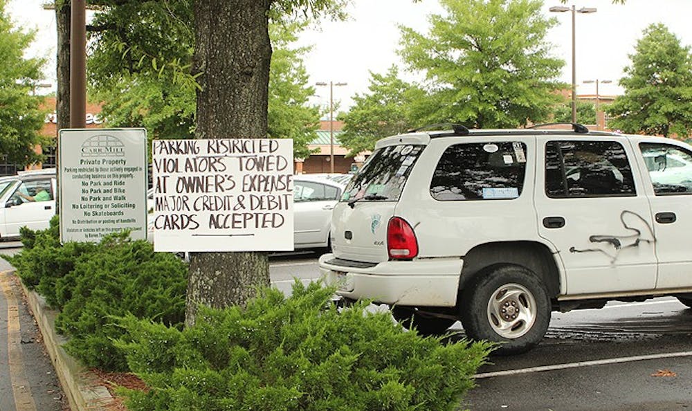 Towing signs in Carr Mill Lot 