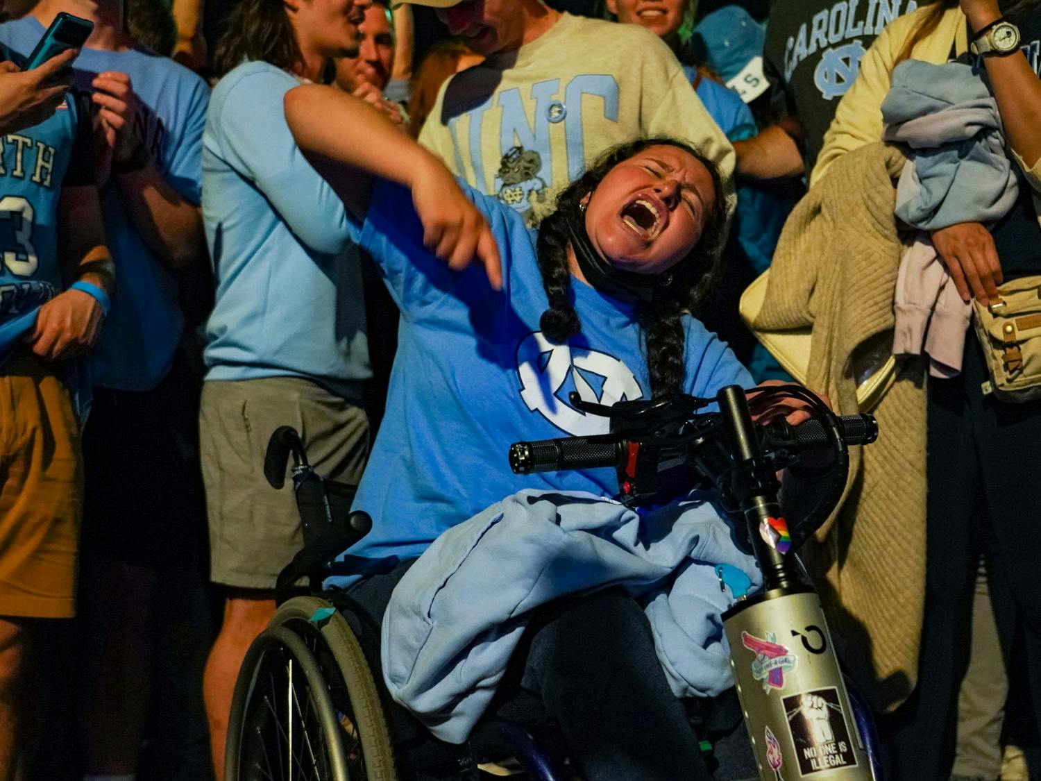 UNC fans celebrate their team's defeat of Duke on Franklin Street during the 2022 Final Four matchup on April 3, 2022. UNC beat Duke 81-77. Photo courtesy of Morgan Pirozzi. 