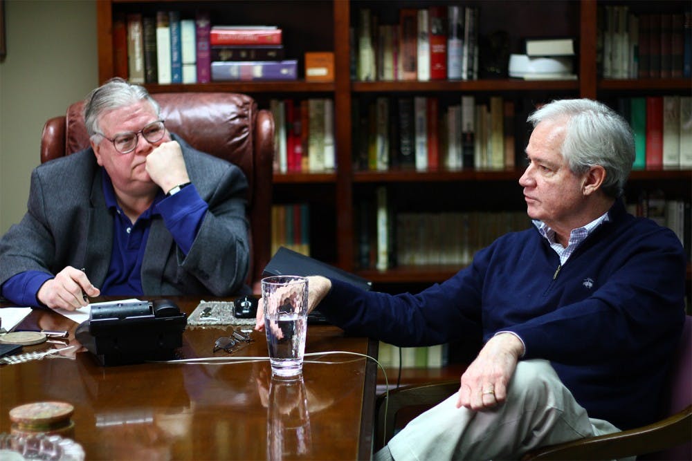 Political consultants Carter Wrenn (left) and Gary Pearce meet in Wrenn's office Wednesday. The two have been friends for several years and have collaborated on a blog for 10 years.