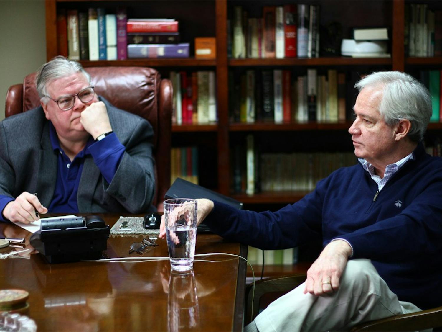 Political consultants Carter Wrenn (left) and Gary Pearce meet in Wrenn's office Wednesday. The two have been friends for several years and have collaborated on a blog for 10 years.