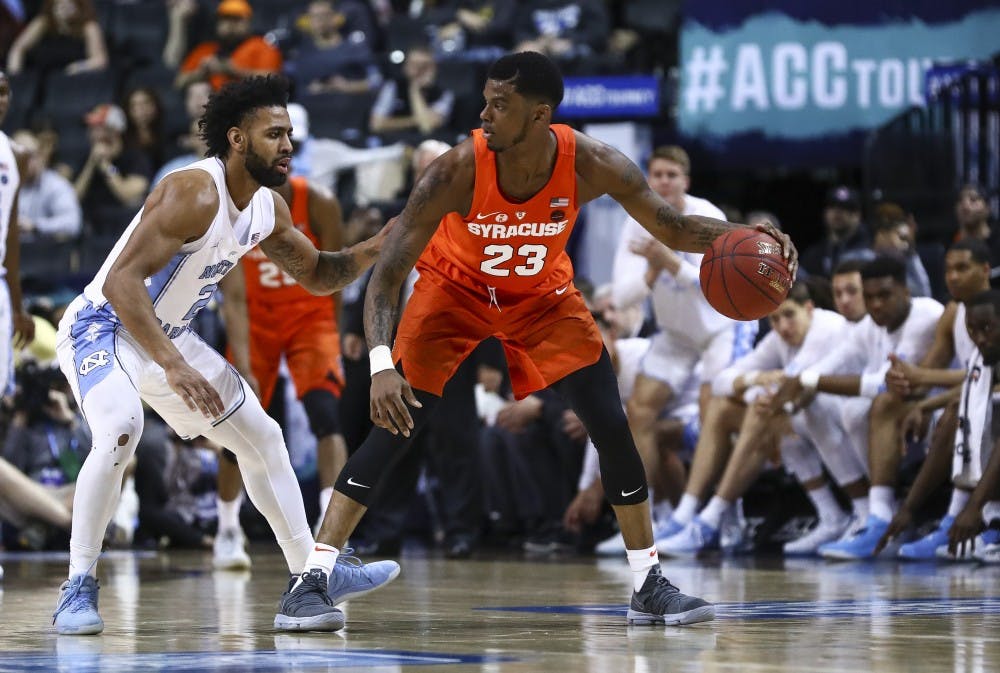 North Carolina's Joel Berry II (2) guards Syracuse's Frank Howard (23) in the second round of the 2018 ACC Tournament on Wednesday night in Brooklyn. Photo courtesy of David Welker, theacc.com
