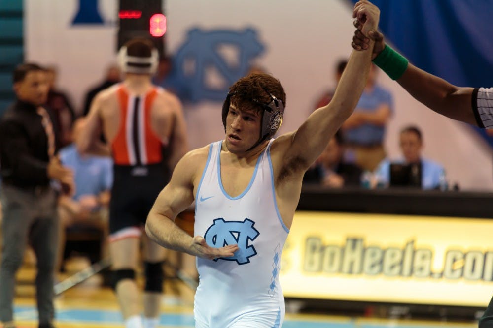 <p>UNC redshirt senior Troy Heilmann won gold in the 149-pound weight class at the ACC Championship on March 3 at Carmichael Arena.</p>