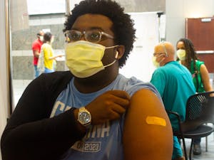 UNC Student Body President Lamar Richards receives his COVID-19 vaccine at the Friday Center on Friday, March 26th, 2021.