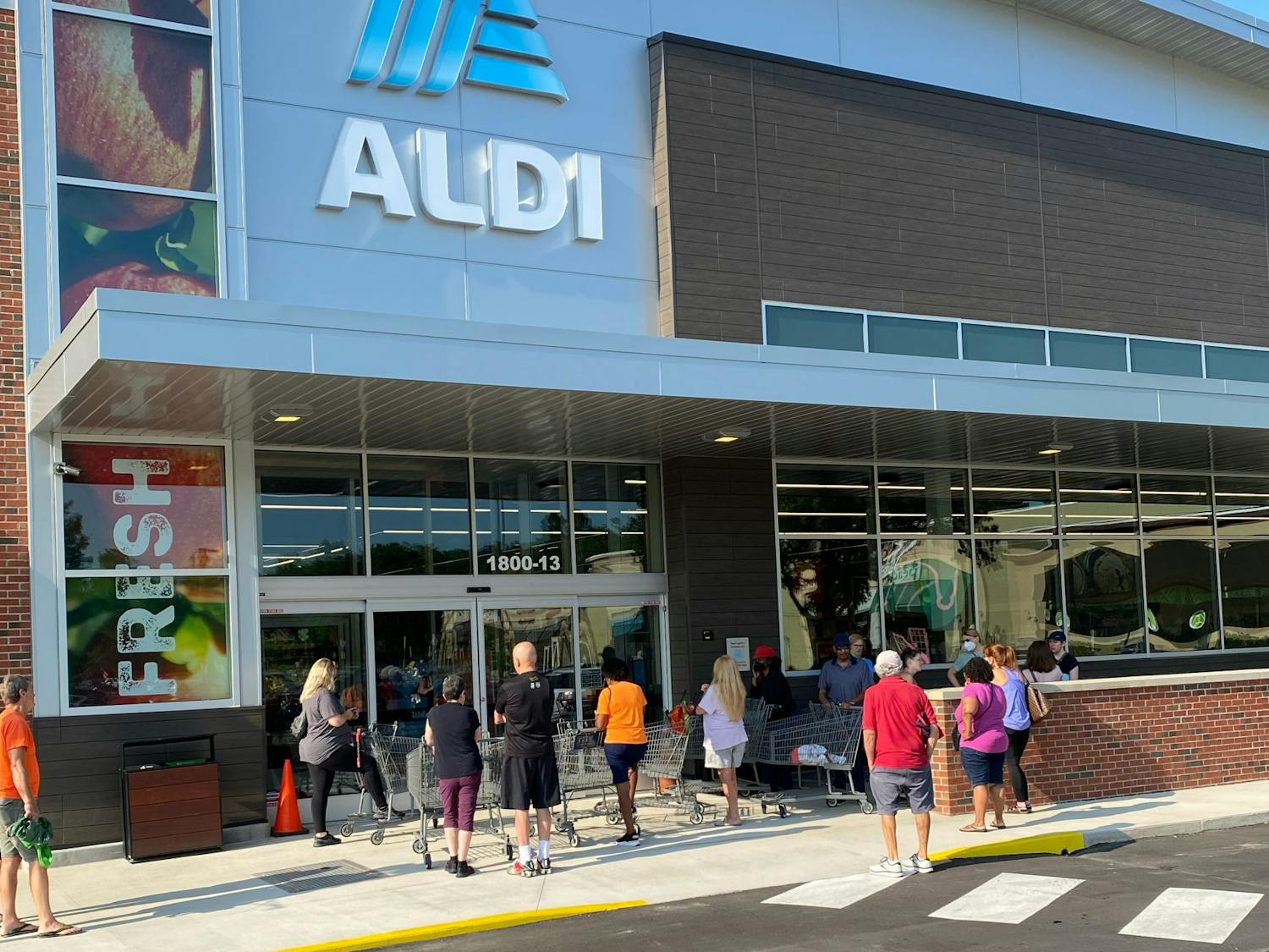 Customers wait in line to shop at Aldi on opening day, Aug. 3 2022.