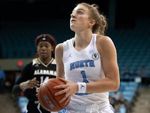 Sophomore guard Alyssa Ustby (1) prepares to shoot the ball at the game against Alabama State on Dec 21, 2021 at Carmichael Arena. UNC won 83-47.