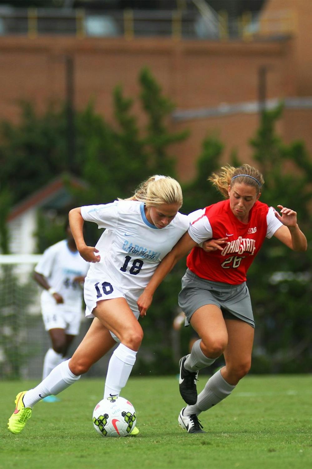UNC midfielder Megan Buckingham (18) tries to create space between herself and Ohio State midfielder Sydney Dudley (26).  Buckingham would go on to score the game-winner for the Tar Heels in their 1-0 win.