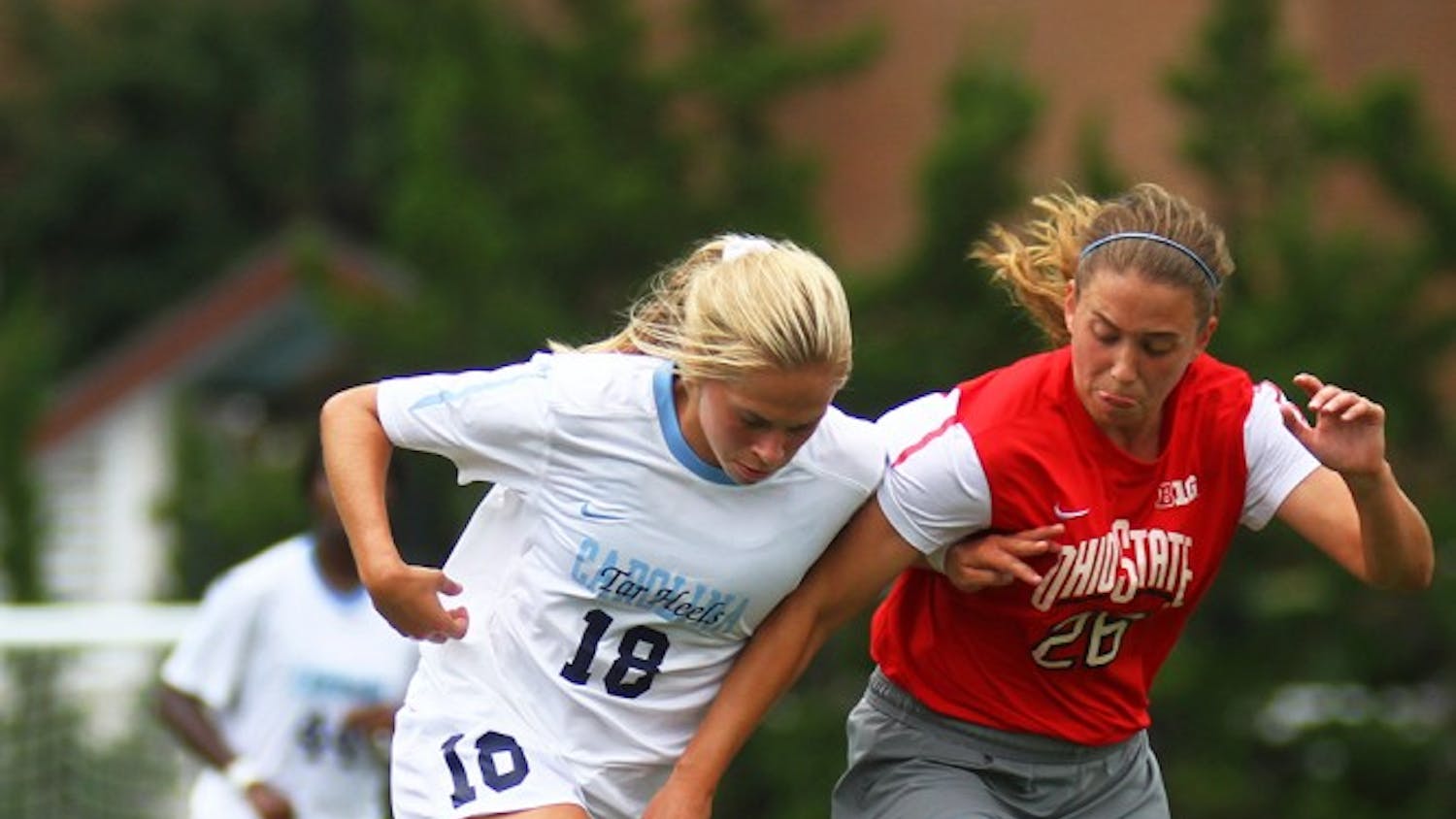 UNC midfielder Megan Buckingham (18) tries to create space between herself and Ohio State midfielder Sydney Dudley (26).  Buckingham would go on to score the game-winner for the Tar Heels in their 1-0 win.