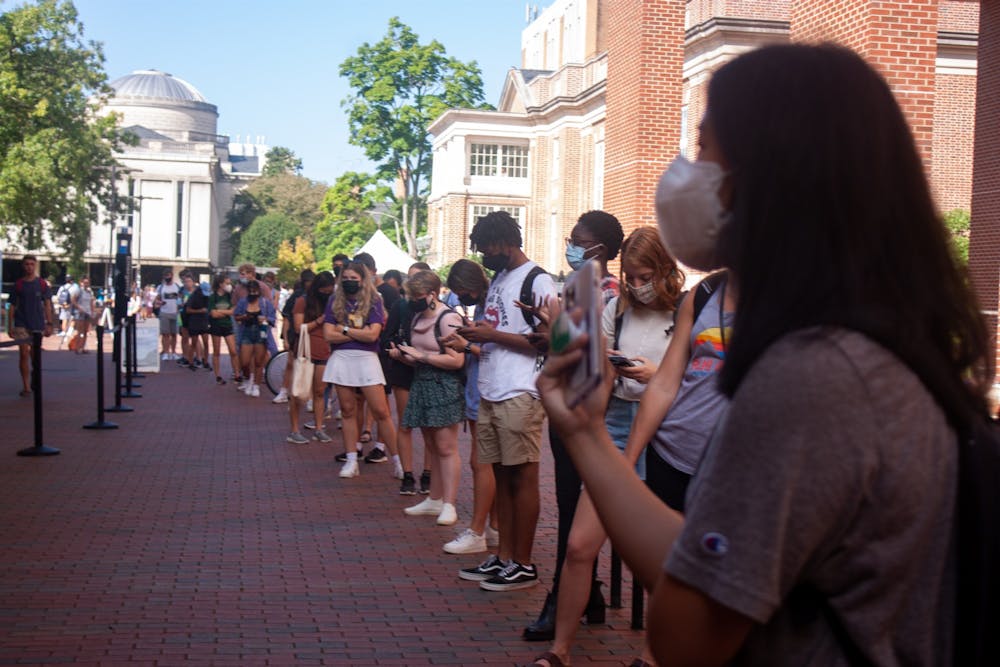 A long line forms Monday outside of the Student Union to get tested for COVID-19.