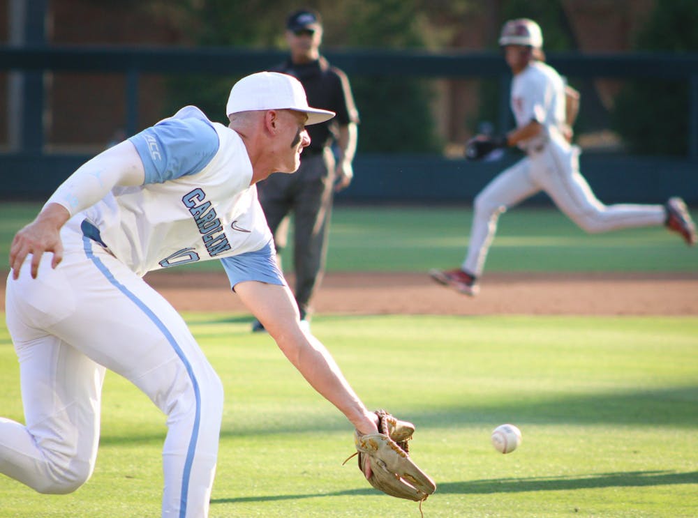 Sophomore third baseman Mac Horvath (10) goes to catch the ball after a Florida State hit. UNC won 10-4 against FSU at home in the second game of the three game series on Friday, May 20, 2022.