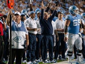 UNC head coach Mack Brown throws up a "goal" sign as the referees reviewed an instant replay during the Tar Heels' home matchup in Kenan Memorial Stadium on Saturday, Sept. 11, 2021 against the Georgia State Panthers. The Tar Heels won 59-17.