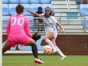First-year forward Tori Dellaperuta (9) looks for an open spot to shoot on goal. UNC won 2-0 at home against UNCW on Sunday, Aug. 21, 2022.
