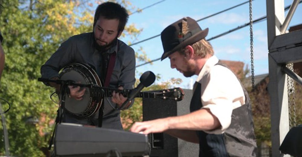 Two members of The Holy Ghost Tent Revival play at Festifall.