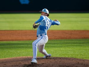 Sophomore Connor Bovair (27) throws a pitch during a UNC men’s baseball game against Longwood on Tuesday, March 1, 2022, at Boshamer Stadium.