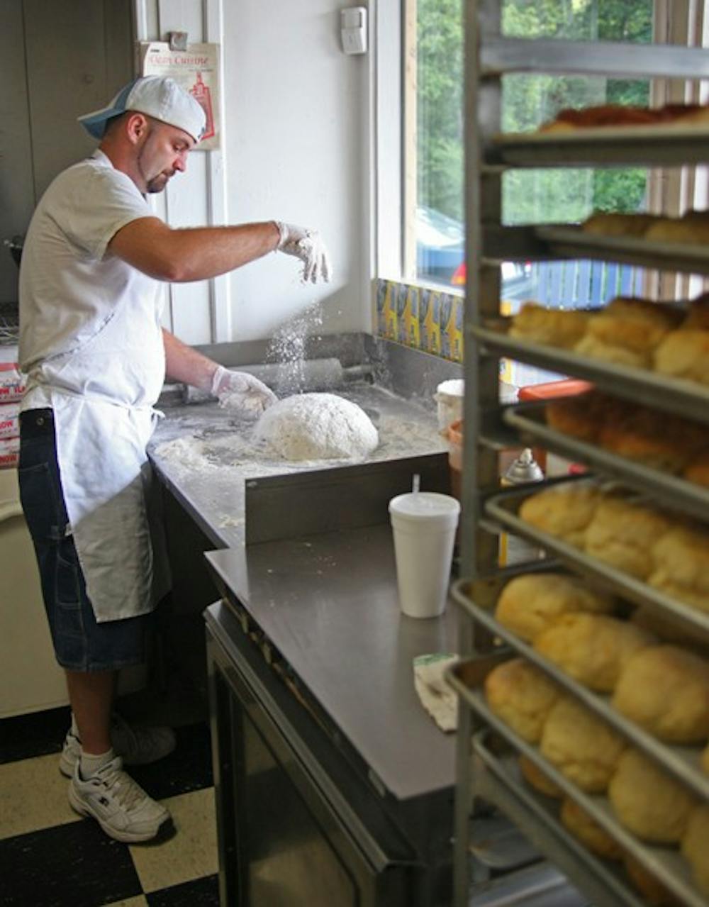 Brian foard makes biscuits at the sunrise Biscuit Kitchen on Tuesday. The kitchen’s fried chicken biscuit was named best breakfast in the state.
