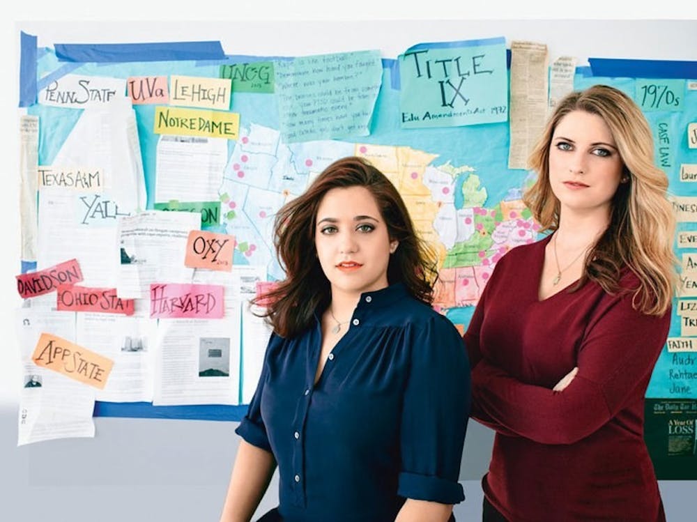 <p>Andrea Pino (<em>left</em>) and Annie Clark in Los Angeles, in front of the map they use to keep track of their work. Photo courtesy of Jeff Lipsky.&nbsp;</p>