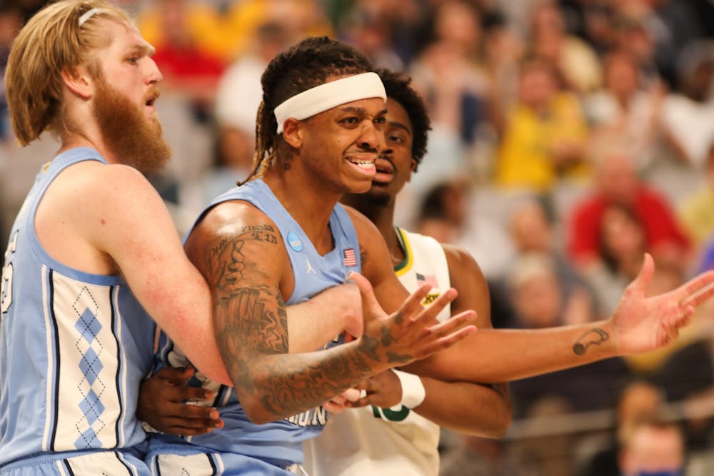 UNC graduate forward Brady Manek (4) holds junior forward Armando Bacot (5) back after a controversial call during the second round of the NCAA tournament against Baylor on Saturday, March 19, 2022, in Fort Worth, Texas. UNC won 93-86.