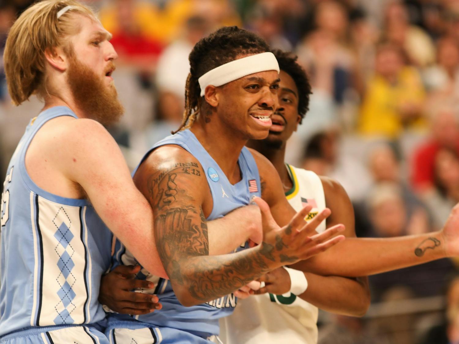 UNC graduate forward Brady Manek (4) holds junior forward Armando Bacot (5) back after a controversial call during the second round of the NCAA tournament against Baylor on Saturday, March 19, 2022, in Fort Worth, Texas. UNC won 93-86.