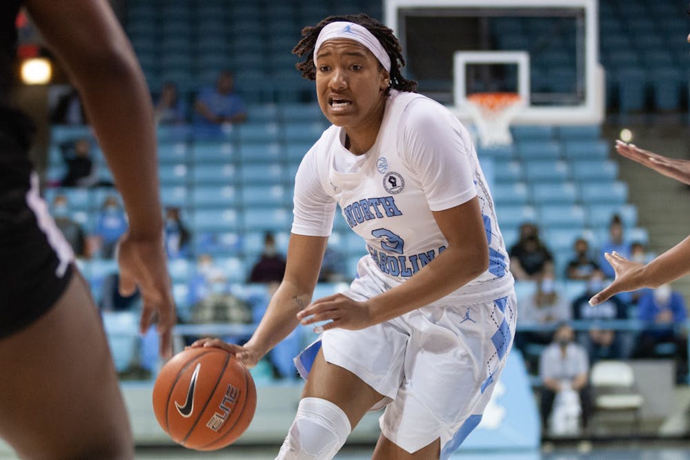 Sophomore guard Kennedy Todd-Williams (3) dribbles the ball at the game against Alabama State on Dec 21, 2021 at Carmichael Arena. UNC won 83-47.