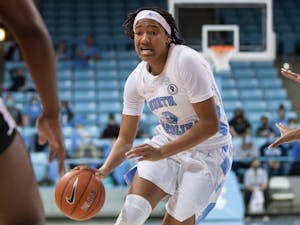 Sophomore guard Kennedy Todd-Williams (3) dribbles the ball at the game against Alabama State on Dec 21, 2021 at Carmichael Arena. UNC won 83-47.