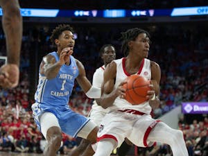UNC graduate forward Leaky Black (1) defends an N.C. State basketball player at PNC Arena on Feb. 19, 2023 at the UNC mens basketball game against the N.C. State Wolfpack.