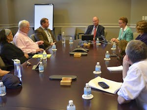 Faculty members gather Monday afternoon in South building for the Faculty Executive Committee meeting.  The meeting, which was led by Executive Vice Chancellor and Provost James W. Dean Jr, covered student binge drinking. 