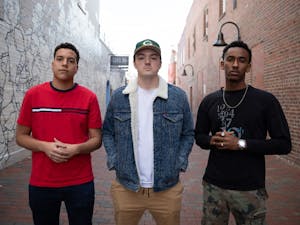 Seniors Nicho Stevens (left), Chris Coogan (middle), and Jemal Abdulhadi (right) of the UNC Student Hip Hop Organization (UNC SHHO) pose for a portrait on Friday, Jan. 18, 2018 in the alley next to Carolina Coffee Shop located on Franklin Street in Chapel Hill, North Carolina. Abdulhadi (right) discussed his experiences as a hip hop artist in lieu of the #MeToo movement which began in October of 2017.