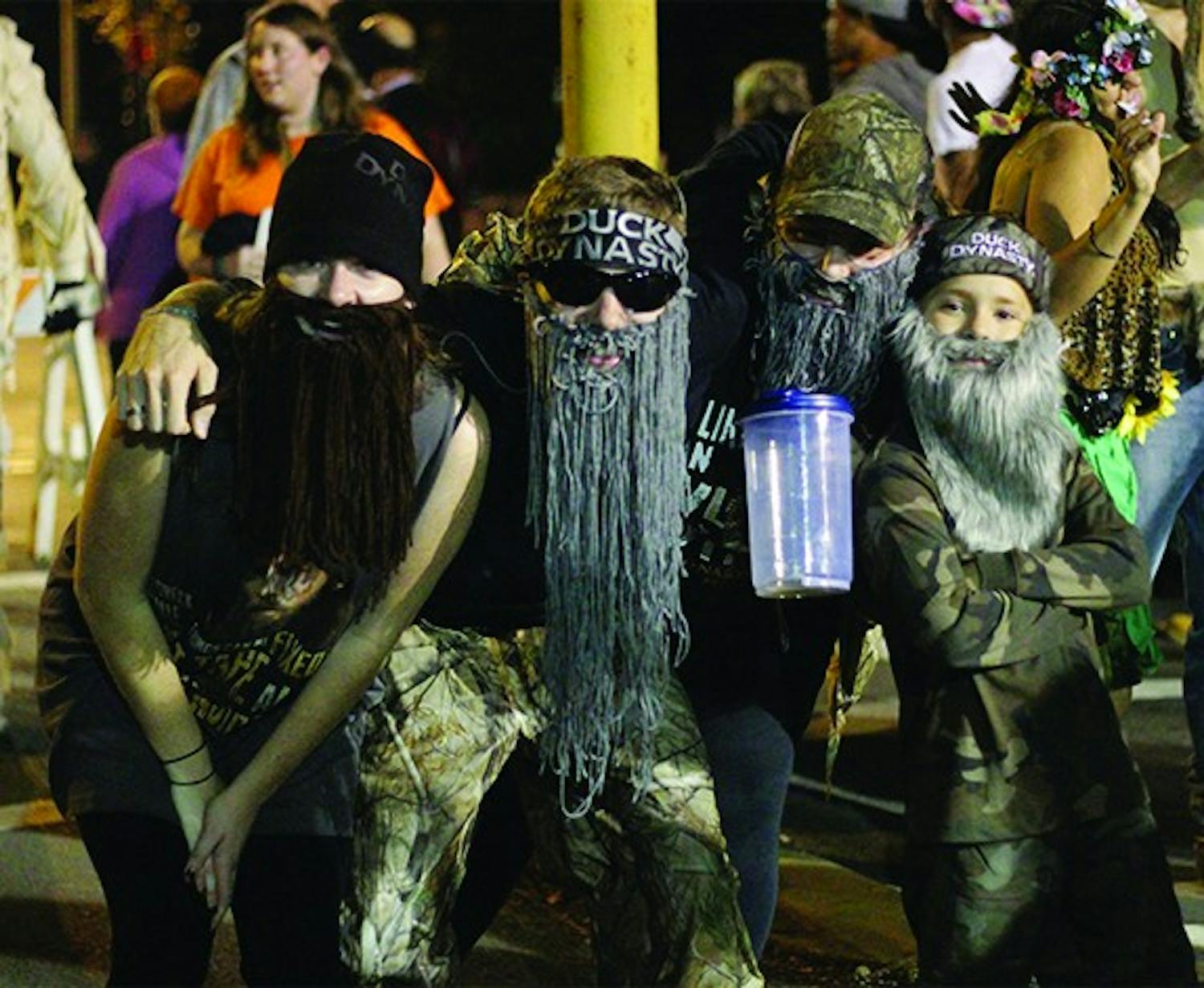 Revelers swarmed the street October 31st to celebrate Halloween on Franklin Street. Around 300 officers were present to make sure the the fifth year of "Homegrown Halloween" went off without a hitch in downtown Chapel Hill. One group decided to dress up as the popular sensation Duck Dynasty, complete with mop beards and a child.