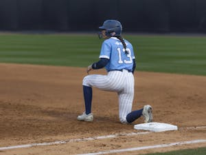 UNC redshirt freshman Isabela Emerling (24) waits at first base during the softball game against Elon at Anderson Stadium on Wednesday, Feb. 15, 2023. UNC beat Elon 9-5.