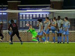 UNC graduate goalkeeper Alec Smir (1) successfully saves a penalty kick during the match against Loyola Marymount on Oct. 19. The Tar Heels defeated the Lions 2-0.