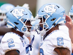 Redshirt freshman wide receiver Gavin Blackwell (2) and redshirt freshman wide receiver Kobe Paysour (8) celebrate after a scored UNC touchdown at the game versus Appalachian State at Kidd Brewer Stadium on Sept. 3, 2022. The Heels won 63-61.