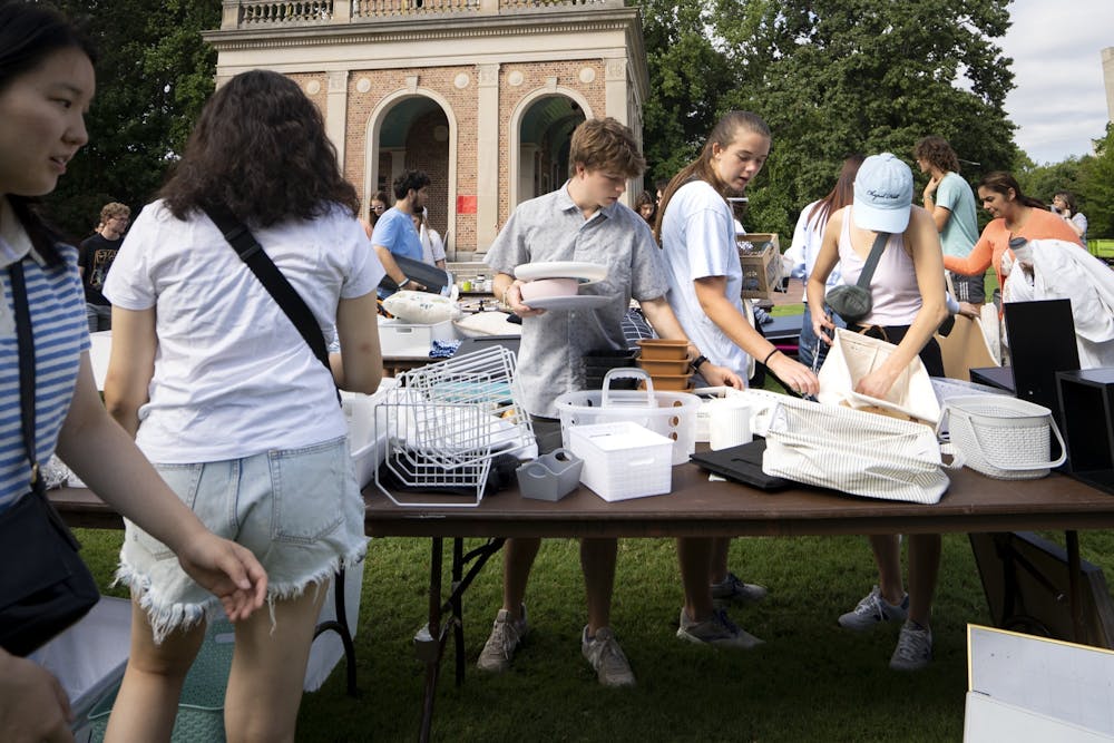 Students shop for move-in items at Carolina Thrift’s sixth annual Back-To-School sale outside of UNC’s Bell Tower on Friday, Aug. 12, 2022.