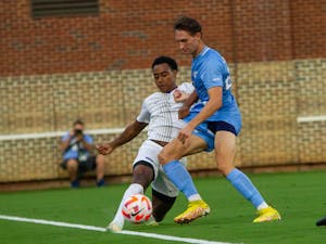 UNC graduate student midfielder and defender Milo Garvanian (22) defends the ball at the men's soccer game against US Air Force Academy on Aug. 25, 2022 at Dorrance Field.