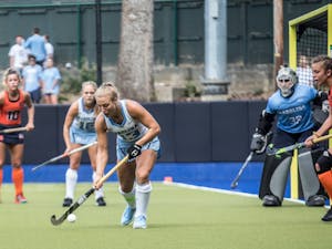 Senior Back Ashley Hoffman (13) of the UNC Field Hockey team defends the ball against Syracuse in a 5-1 win on Saturday, Sept. 29, 2018, at Karen Shelton Stadium in Chapel Hill, NC.