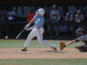 UNC junior outfielder Dylan Harris (3) hits the ball during the final game of the Chapel Hill Super Regionals on Monday, June 10, 2019. UNC lost to Auburn 14-7.