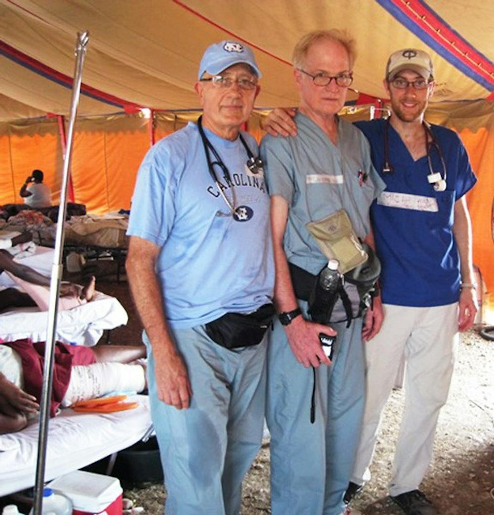 Local doctors Frank Tew (left) and Pat Guiteras (center) with Brown University med student Micah Johnson. Courtesy of Frank Tew