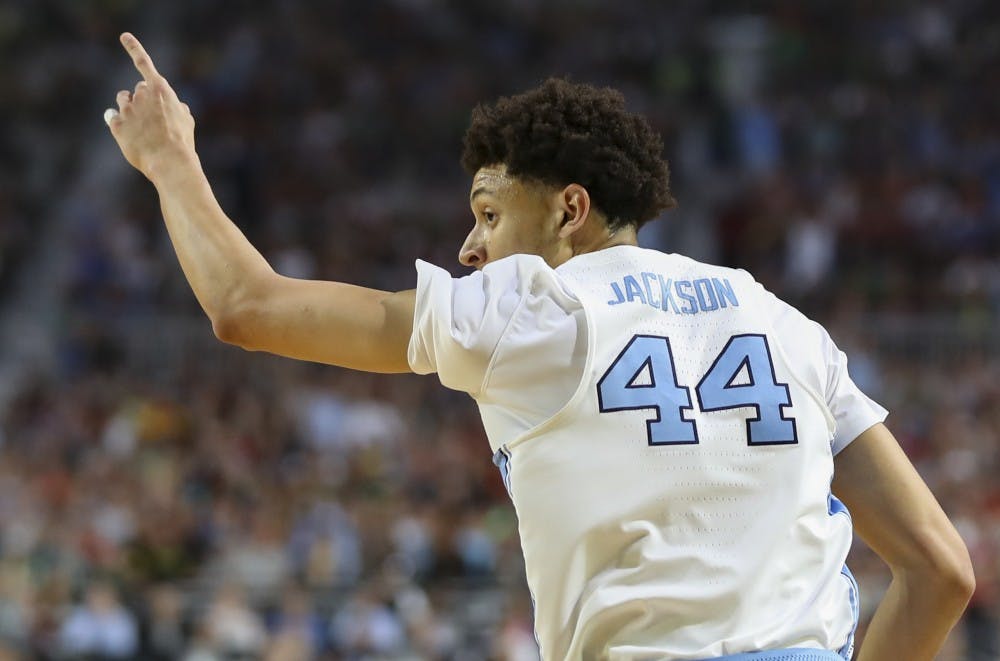 North Carolina wing Justin Jackson (44) points to the bench after hitting a 3-pointer against Oregon in the teams' Final Four matchup on Saturday in Phoenix.