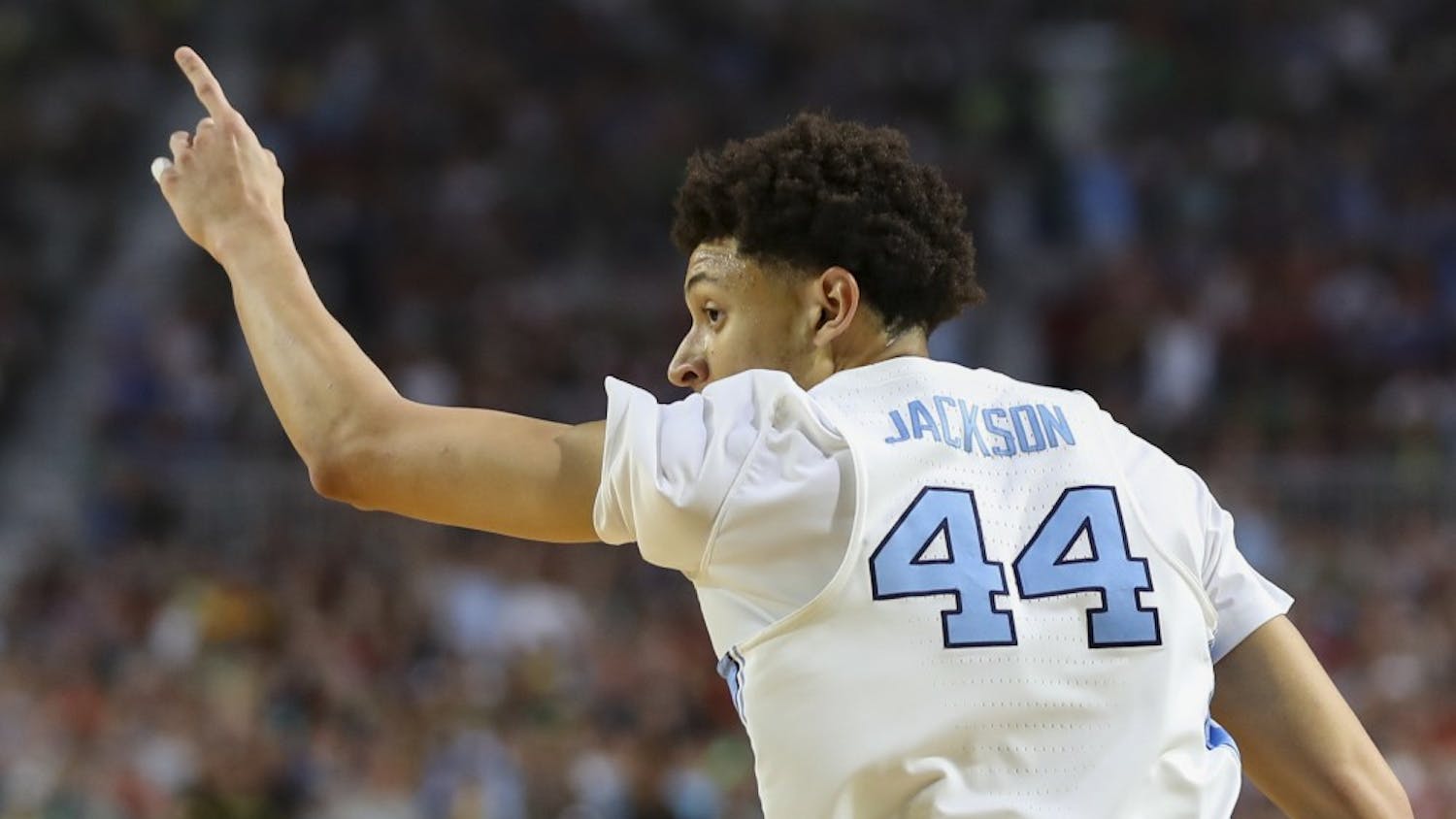 North Carolina wing Justin Jackson (44) points to the bench after hitting a 3-pointer against Oregon in the teams' Final Four matchup on Saturday in Phoenix.