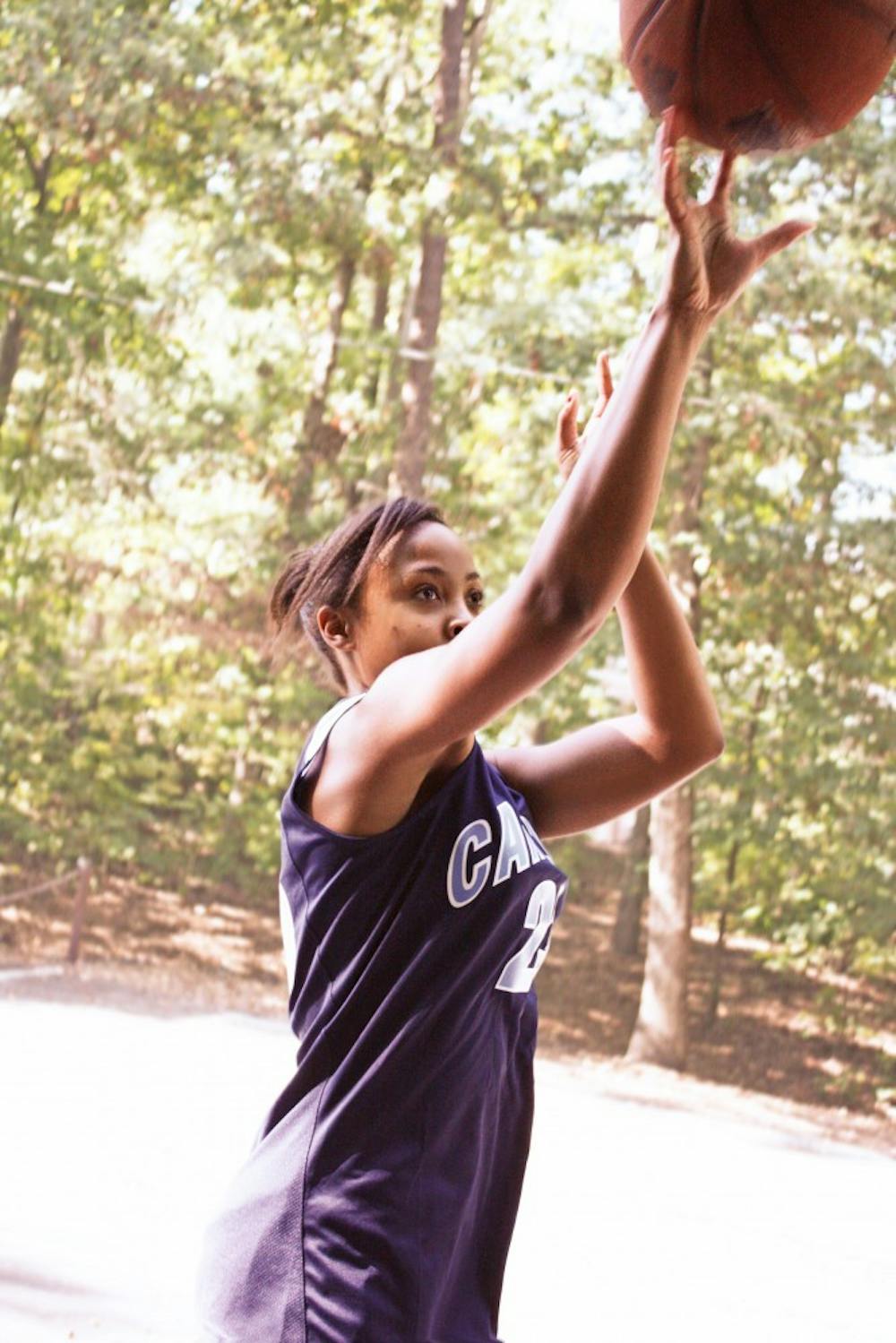 	<p>Miss <span class="caps">UNC</span> Black &amp; Gold &#8217;11, Porscha Armwood, practices her jump shot on the old goals near Odum village. </p>