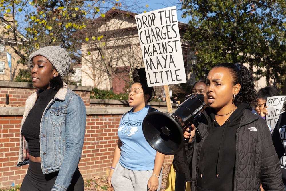UNC's Black Student Movement, Black Congress and student and local activists convened in McCorkle place before marching to South Building on Thursday, Dec. 5, 2019 at 1 p.m. The activists protested the University giving $2.5 million and Silent Sam to the Sons of Confederate Veterans.