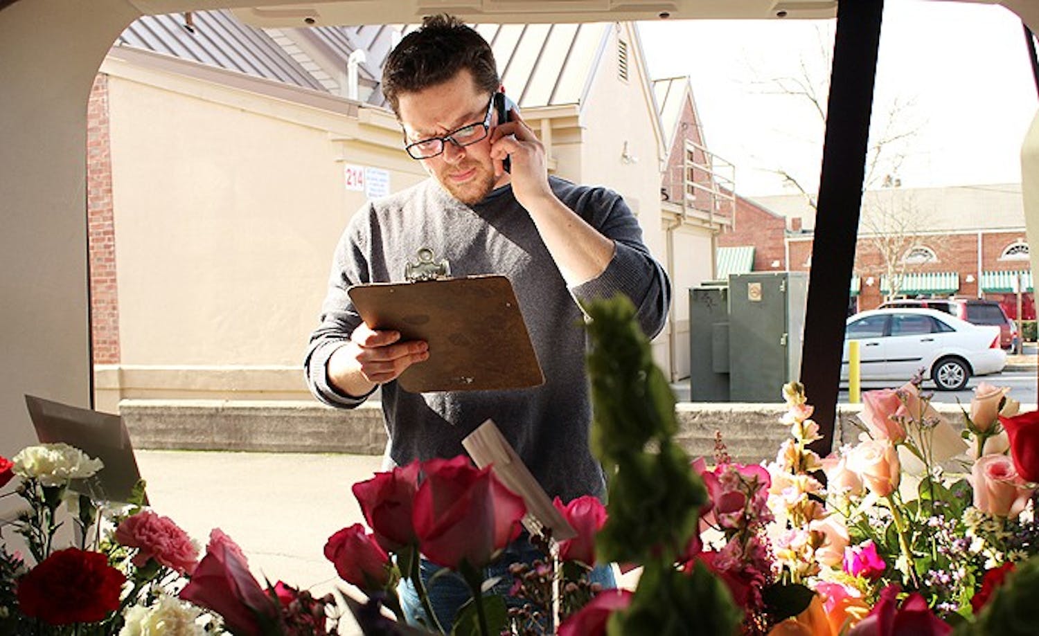 Stephen Cosoli from University Florist on East Franklin Street makes deliveries on Valentines day