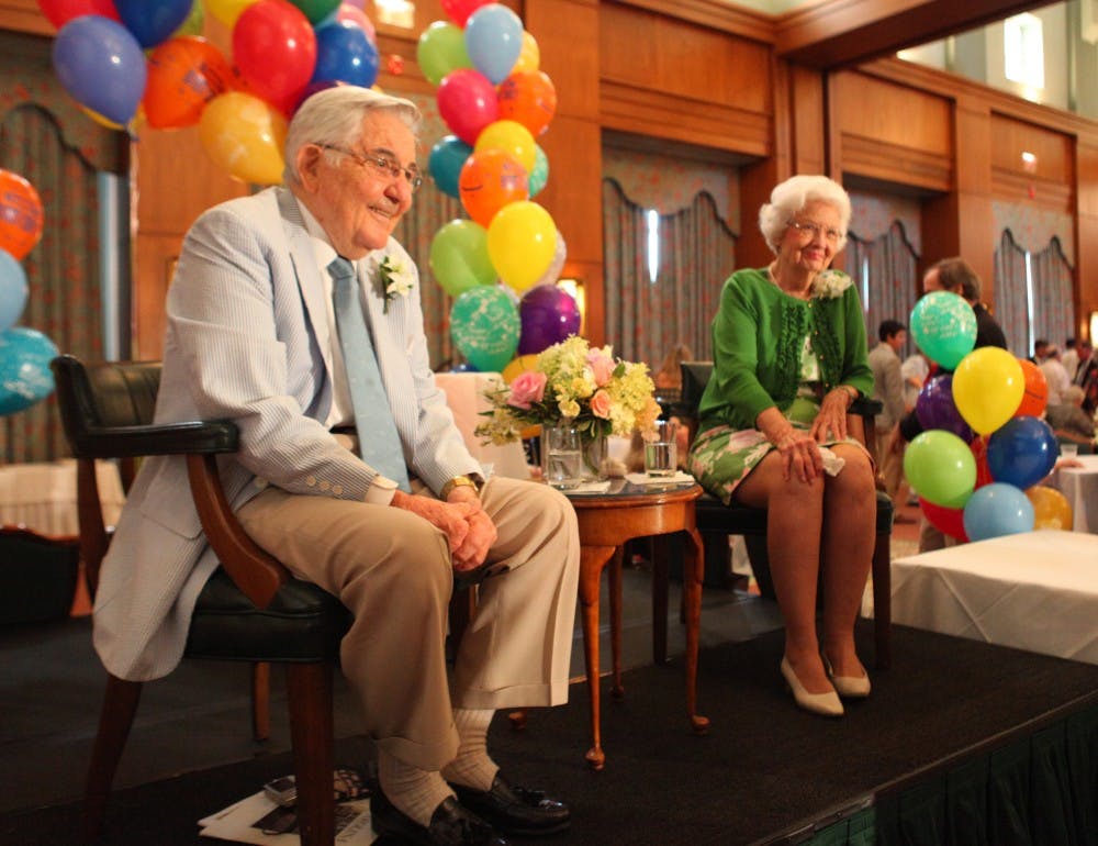 Former UNC system president William Friday and his wife Ida greet visitors at his 90th birthday celebration Tuesday. The event, which was held in the Carolina Club at the Hill Alumni Center, was open to the public. Friday served as the UNC system president for 30 years. 