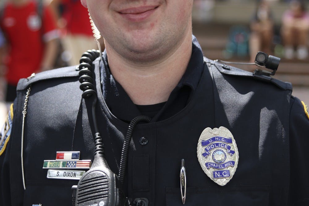 <p>Officer S. Dixon wears a body camera on his left shoulder in the Pit on Wednesday August 24th.</p>
