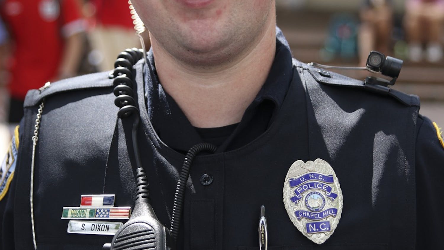 Officer S. Dixon wears a body camera on his left shoulder in the Pit on Wednesday August 24th.