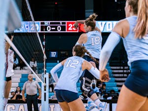 UNC first-year Liv Mogridge (18) wins a point off a hit in a close first set during the volleyball match against Louisville on Sunday, Nov. 13, 2022. UNC fell 3-0 to Louisville.