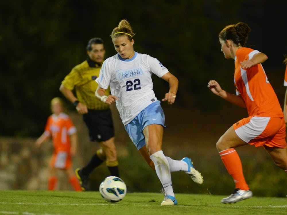 UNC Senior Amber Brooks (22) dribbles the ball up field against Florida on August 24th, 2012 at Fetzer Field in Chapel Hill, North Carolina.