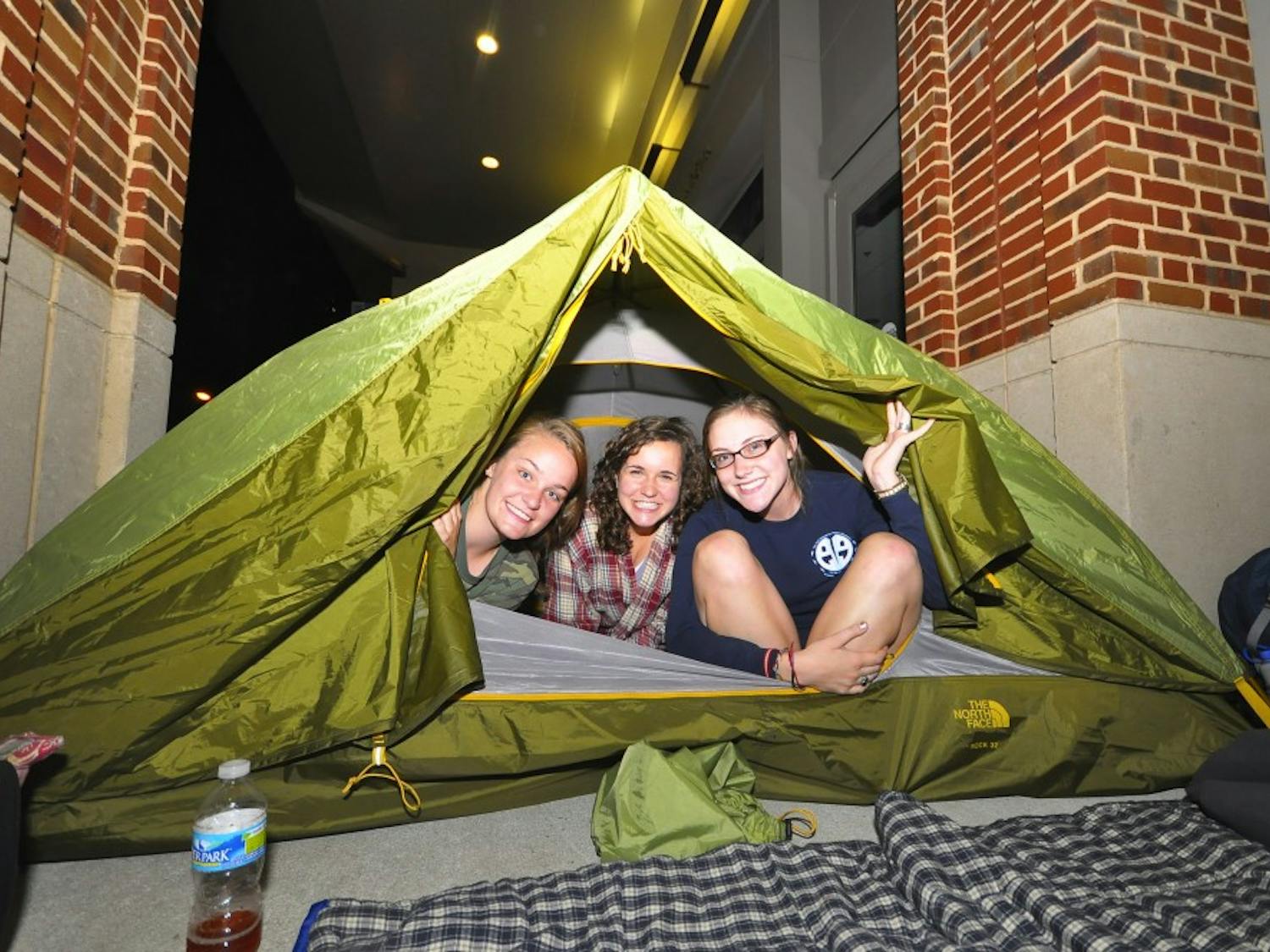 Juniors Sarah Kaminer and Amanda Srsic and freshman Molly Williams started waiting in line for Obama tickets at 10pm Saturday night. The box office opened an hour early to students and the public.