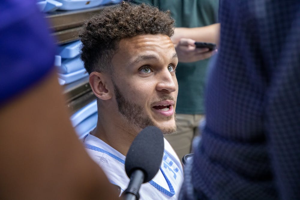 <p>Pete Nance, a graduate transfer from Northwestern, speaks with reporters at a press conference in the Dean E. Smith Center on July 18, 2022.</p>
